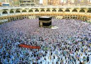 a large group of people standing around a kabab