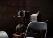 AC motor-powered machine behind chair