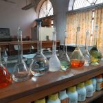 clear glass bottles on brown wooden table