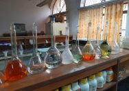clear glass bottles on brown wooden table