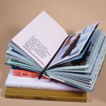 open book on top of several stacked books