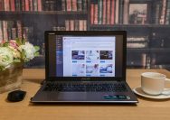 black laptop computer on brown wooden table