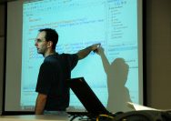 man in black crew neck t-shirt using black laptop computer