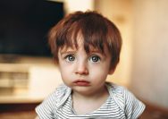 boy in white and black striped crew neck shirt
