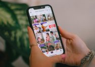 A person holding a cell phone in their hand