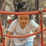 a girl holding a rope