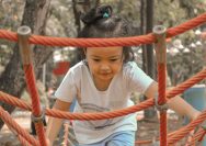 a girl holding a rope