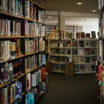 a long row of bookshelves filled with books